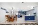 Open living space and kitchen with updated appliances and modern design, perfect for entertaining at 1412 Gulf Blvd # 103A, Indian Rocks Beach, FL 33785