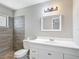 Modern bathroom with tile accents, updated vanity, and a well-lit mirror at 1530 High Knoll Dr, Brandon, FL 33511