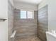 Shower with tiled wall accents and updated fixtures at 1530 High Knoll Dr, Brandon, FL 33511