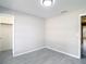 This bedroom features wood-look tile flooring, a large closet, and fresh paint at 1530 High Knoll Dr, Brandon, FL 33511