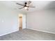 Bedroom featuring a ceiling fan, a closet, and tile flooring at 1530 High Knoll Dr, Brandon, FL 33511
