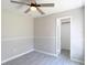 A neutral bedroom features a ceiling fan and a closet for ample storage space at 1530 High Knoll Dr, Brandon, FL 33511