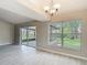 Dining area with view of lanai, adjacent to window overlooking the backyard at 1530 High Knoll Dr, Brandon, FL 33511