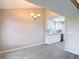 Dining room with chandelier and access to a remodeled kitchen with white cabinets at 1530 High Knoll Dr, Brandon, FL 33511