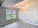 Dining area features a window overlooking a landscaped yard, plus a decorative chandelier at 1530 High Knoll Dr, Brandon, FL 33511