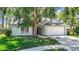 Charming single-story home featuring a spacious front yard and a two-car garage at 1530 High Knoll Dr, Brandon, FL 33511