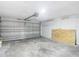 Spacious two-car garage with overhead door and concrete flooring at 1530 High Knoll Dr, Brandon, FL 33511