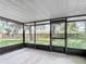 Enclosed lanai overlooking the spacious backyard at 1530 High Knoll Dr, Brandon, FL 33511