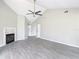 Open living room with vaulted ceiling, fireplace, tile flooring, and bright front door at 1530 High Knoll Dr, Brandon, FL 33511