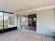Covered patio with sliding glass doors into living room with tile floors at 1530 High Knoll Dr, Brandon, FL 33511