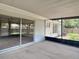 Screened patio with concrete floor and ceiling fan provides shade from the sun at 1530 High Knoll Dr, Brandon, FL 33511