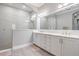 Bathroom showcasing double vanity with stone countertops and a large shower at 16677 Vibrato Ln, Land O Lakes, FL 34638