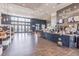 A cafe is shown with a large granite countertop, high top seating and an area to relax and have a snack at 16677 Vibrato Ln, Land O Lakes, FL 34638