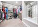 Walk-in closet offering ample storage with custom shelving and spacious layout at 16677 Vibrato Ln, Land O Lakes, FL 34638