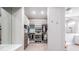 Spacious walk-in closet with custom shelving, hanging racks, and convenient access to the attached bathroom at 16677 Vibrato Ln, Land O Lakes, FL 34638