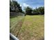 Spacious backyard with chain link fence. Perfect for outdoor activities and enjoying nature at 17026 State Road 54, Lutz, FL 33558