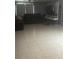 Spacious living room featuring tile floors and a comfortable seating area at 17026 State Road 54, Lutz, FL 33558