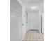Hallway with closet space, leading into a clean interior and functional layout at 17400 Gulf Blvd # I4, North Redington Beach, FL 33708