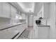 Cozy kitchen featuring ample cabinet space, white appliances, and a convenient layout for cooking at 17400 Gulf Blvd # I4, North Redington Beach, FL 33708