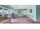A comfortable living room with a balcony and a great view of the outdoor scenery at 17400 Gulf Blvd # I4, North Redington Beach, FL 33708