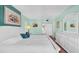 Light-filled primary bedroom featuring white furniture, a comfortable bed, and serene decor at 17400 Gulf Blvd # I4, North Redington Beach, FL 33708