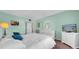 Well-lit primary bedroom with neutral tones, white furniture, and a peaceful ambiance at 17400 Gulf Blvd # I4, North Redington Beach, FL 33708