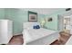Tranquil primary bedroom featuring clean white decor, soft bedding, and closet access at 17400 Gulf Blvd # I4, North Redington Beach, FL 33708