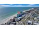 Panoramic aerial shot of beachside condos, turquoise ocean, and coastal community with boats at 17400 Gulf Blvd # J7, Redington Shores, FL 33708