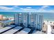 Exterior of a waterfront apartment building on a sunny day with beach access at 17400 Gulf Blvd # J7, Redington Shores, FL 33708