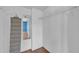Walk-in closet with ample shelving, hanging space, and wood floors at 17400 Gulf Blvd # J7, Redington Shores, FL 33708