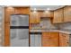 Kitchen showcasing stainless steel appliances, granite countertops, and light wood cabinetry at 17400 Gulf Blvd # J7, Redington Shores, FL 33708