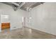 Loft bedroom showcasing exposed ceiling, concrete floors, and brick detail at 175 2Nd S St # 907, St Petersburg, FL 33701