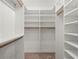 Walk-in closet with built-in shelving and hanging racks for organized storage at 175 2Nd S St # 907, St Petersburg, FL 33701