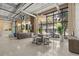 Contemporary dining area with bar, large window, and modern chandelier at 175 2Nd S St # 907, St Petersburg, FL 33701