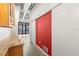 Modern hallway with built-in storage that leads to a bright room with balcony and water views at 175 2Nd S St # 907, St Petersburg, FL 33701