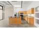 Open kitchen featuring an island with granite counters and stainless appliances at 175 2Nd S St # 907, St Petersburg, FL 33701