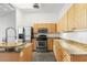 The kitchen features stainless steel appliances, granite counters, and wood cabinetry at 175 2Nd S St # 907, St Petersburg, FL 33701