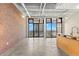 Bright loft living room with expansive windows and city views at 175 2Nd S St # 907, St Petersburg, FL 33701