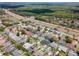 A serene aerial view capturing a residential area with mature landscaping and attractive homes at 1805 Stable Trl, Palm Harbor, FL 34685