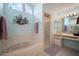 This stylish bathroom features bathtub, stand up shower, double sinks and plenty of natural light at 1805 Stable Trl, Palm Harbor, FL 34685