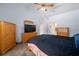 This bedroom offers carpet floors, spacious closet, large window and en-suite bathroom at 1805 Stable Trl, Palm Harbor, FL 34685