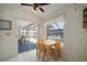 Bright dining area with sliding doors offering a view of the pool and patio at 1805 Stable Trl, Palm Harbor, FL 34685