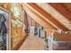 Spacious attic storage area with exposed rafters and insulation at 1927 Curry Rd, Lutz, FL 33549