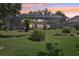 Spacious backyard with screened patio and lush landscaping at 1927 Curry Rd, Lutz, FL 33549