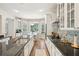 Spacious kitchen with granite countertops, stainless appliances, white cabinetry and breakfast nook overlooking the backyard at 1927 Curry Rd, Lutz, FL 33549