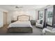 Main bedroom with ensuite, ceiling fan, walk-in closet and large window at 1927 Curry Rd, Lutz, FL 33549