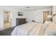 Main bedroom with carpet, ceiling fan, ensuite bath and walk-in closet at 1927 Curry Rd, Lutz, FL 33549