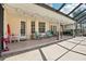 Enjoy this covered patio with an array of seating options, ideal for outdoor relaxation at 1927 Curry Rd, Lutz, FL 33549