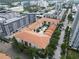 Aerial view of a condo community, showcasing the central pool, lush landscaping, and surrounding cityscape at 200 4Th S Ave # 303, St Petersburg, FL 33701
