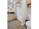 Bathroom featuring tile flooring, wood cabinets, solid surface countertop, and tub with shower at 200 4Th S Ave # 303, St Petersburg, FL 33701